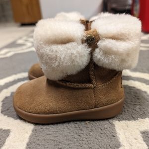 Ugg baby toddler fur lined boot.  Size 4